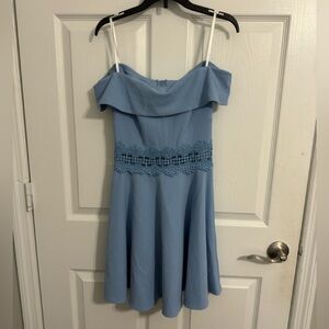 Off the shoulder mini light blue dress, design around the waist that shows skin